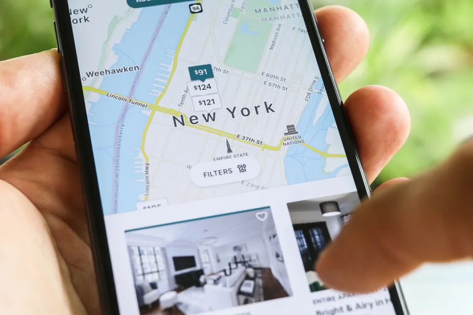Close-up of phone with Airbnb map of New York